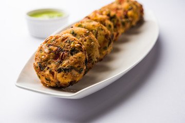 Crispy Corn Tikki, pakora/pakoda or pattice also known as cutlet. served with green chutney. Selective focus