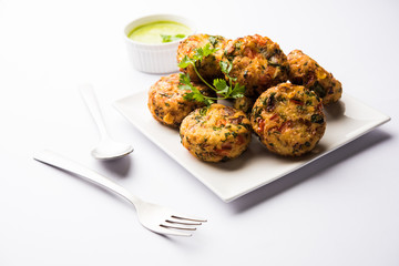 Crispy Corn Tikki, pakora/pakoda or pattice also known as cutlet. served with green chutney. Selective focus
