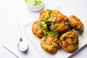 Crispy Corn Tikki, pakora/pakoda or pattice also known as cutlet. served with green chutney. Selective focus
