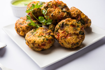 Crispy Corn Tikki, pakora/pakoda or pattice also known as cutlet. served with green chutney. Selective focus