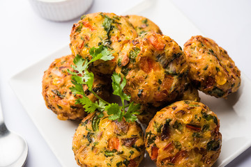 Crispy Corn Tikki, pakora/pakoda or pattice also known as cutlet. served with green chutney. Selective focus