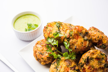 Crispy Corn Tikki, pakora/pakoda or pattice also known as cutlet. served with green chutney. Selective focus