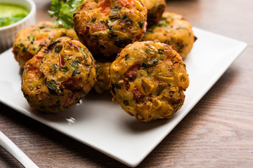 Crispy Corn Tikki, pakora/pakoda or pattice also known as cutlet. served with green chutney. Selective focus