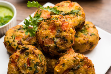 Crispy Corn Tikki, pakora/pakoda or pattice also known as cutlet. served with green chutney. Selective focus