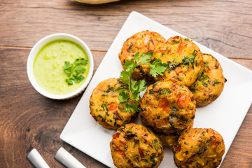 Crispy Corn Tikki, pakora/pakoda or pattice also known as cutlet. served with green chutney. Selective focus