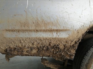 lots of dry muddy on car