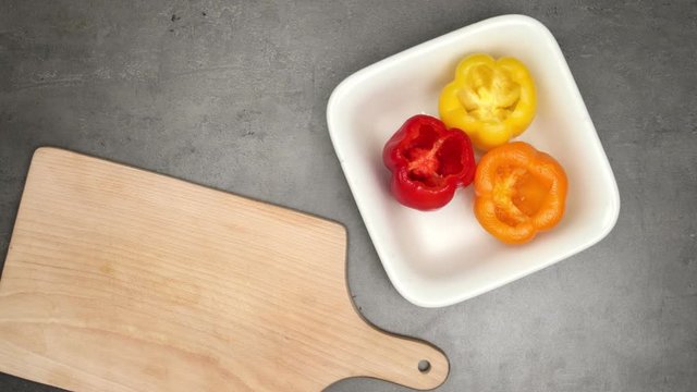 Filled sweet peppers. Top view on recipe preparation. Food stop motion animation.