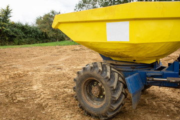 Image of front dumper truck in construction site. Copy space.