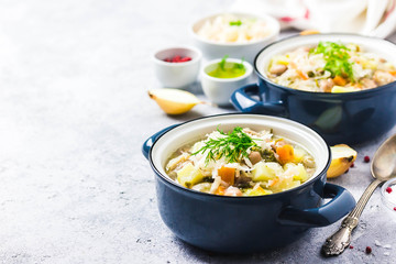 Sauerkraut red bean meat soup in pots.Selective focus, space for text.