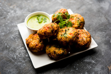 Crispy Corn Tikki, pakora/pakoda or pattice also known as cutlet. served with green chutney. Selective focus