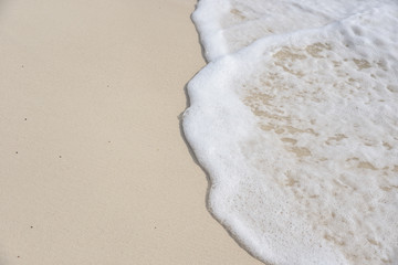 warm ocean on white sand