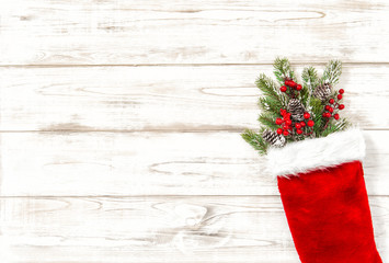 Obraz na płótnie Canvas Christmas tree branches red decoration wooden background