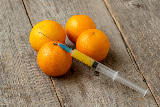 Syringe and tangerines