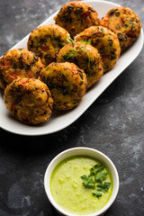 Crispy Corn Tikki, pakora/pakoda or pattice also known as cutlet. served with green chutney. Selective focus