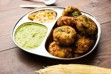 Crispy Corn Tikki, pakora/pakoda or pattice also known as cutlet. served with green chutney. Selective focus