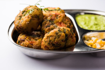 Crispy Corn Tikki, pakora/pakoda or pattice also known as cutlet. served with green chutney. Selective focus