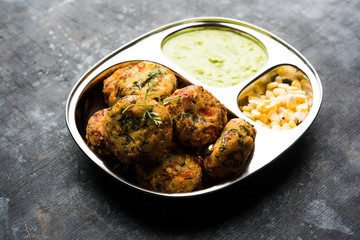 Crispy Corn Tikki, pakora/pakoda or pattice also known as cutlet. served with green chutney. Selective focus