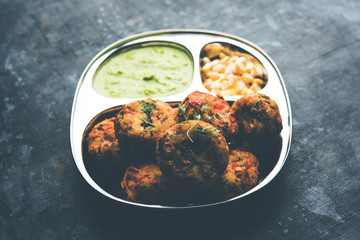 Crispy Corn Tikki, pakora/pakoda or pattice also known as cutlet. served with green chutney. Selective focus