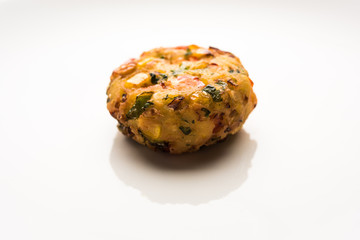 Crispy Corn Tikki, pakora/pakoda or pattice also known as cutlet. served with green chutney. Selective focus