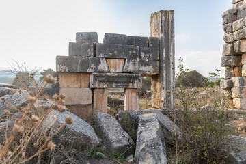 The remains  of the central entrance on the ruins of the destroyed Roman temple, located in the fortified city on the territory of the Naftali tribe in Tel Kadesh in the north of Israel