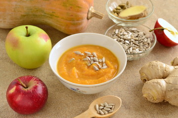 Roasted apple, pumpkin, ginger soup with cardamom, sprinkled with sunflower seeds