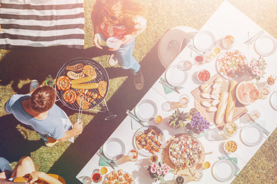 High Angle On People Grilling Food Next To Table During Barbecue Party In The Park