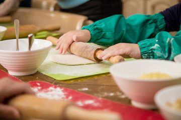 children prepare baked buns
