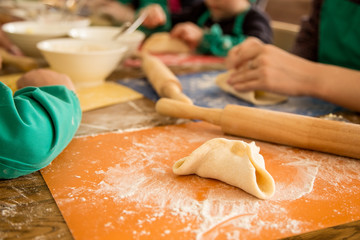 children prepare baked buns