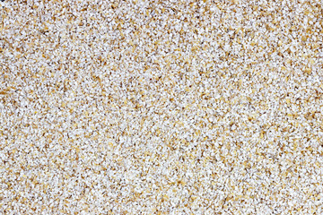 Raw ground barley background with copy space