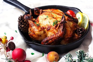 Homemade Cornish Hen roast / Thanksgiving Christmas dinner on holiday frame - obrazy, fototapety, plakaty