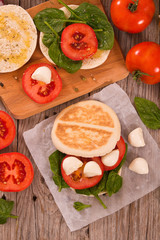 Tigella bread with spinach and tomatoes.