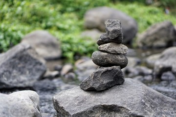 Fototapeta na wymiar Stone balancing on the edge of the river