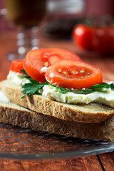 Sandwich toast bread for breakfast with cheese and orange juice, tomatoes, lettuce
