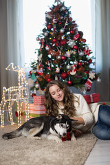 Teen girl with dog for Christmas