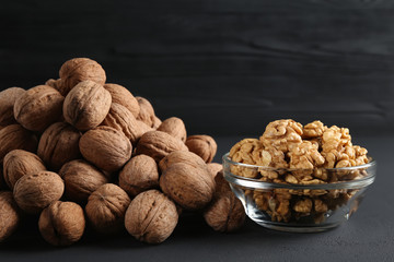bowl of walnut kernels on a dark background