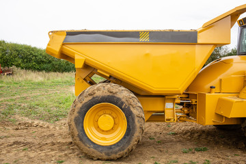 Front tipper parked in construction site. Copy space.