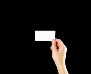 Hand holding blank brochure booklet in the hand. Isolated on black background. Man show offset...