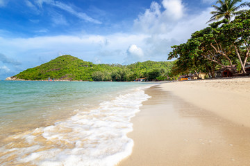 Beautiful delightful incredible tropical beach, white sand, blue sky with clouds, postcard