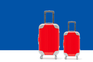 Let's go travel concept. red suitcase with copy space.