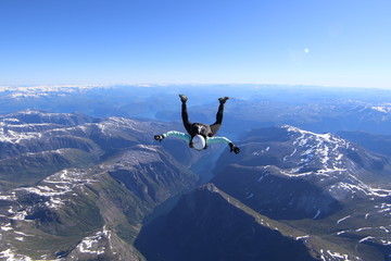 Wingsuti skydiving over Norway - obrazy, fototapety, plakaty