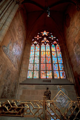 Fototapeta na wymiar Stained glass windows of St. Vitus in Prague, Czech Republic