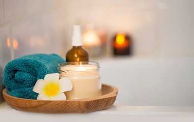 Obraz na płótnie Canvas Spa setting with candle, flower and towel, skincare treatment home spa