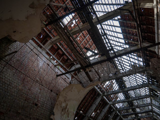 Broken roof on an abandoned church in old British military barracks in Werl, Germany, falling apart and vandalized