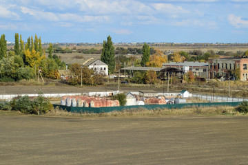 View of an old base of combustible lubricants. Barrels for storing gasoline. An old settlement