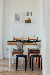 Festive table, minimalistic Christmas decor. Scandinavian interior