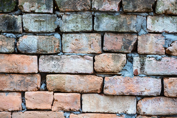 Broken brick wall  fixed with cement, Brick wall background