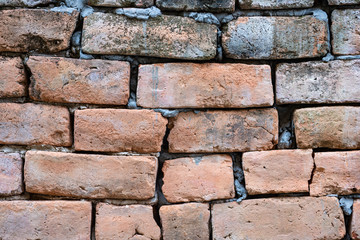 Broken brick wall  fixed with cement, Brick wall background
