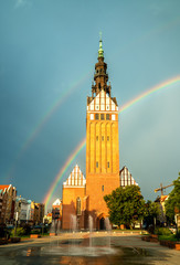 St. Nicholas Cathedral with a rainbow in Elblag, Poland