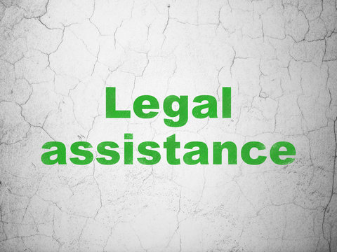 Law concept: Green Legal Assistance on textured concrete wall background