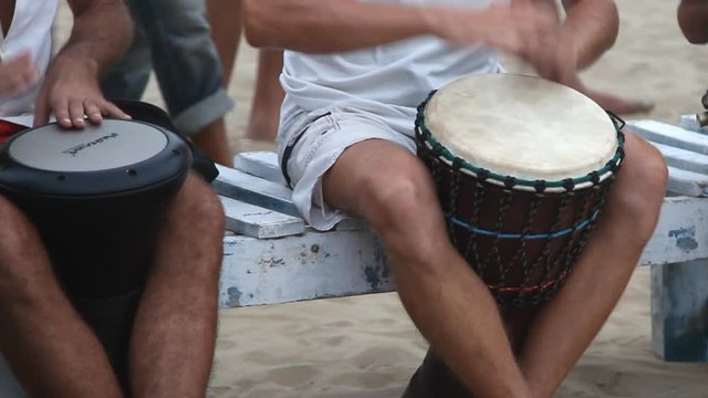 Unidentified man playing on drum 